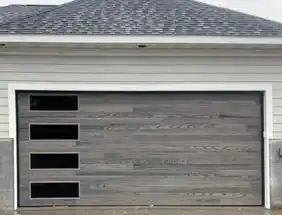CHI Planks contemporary garage door in gray with vertical side windows, modern siding.