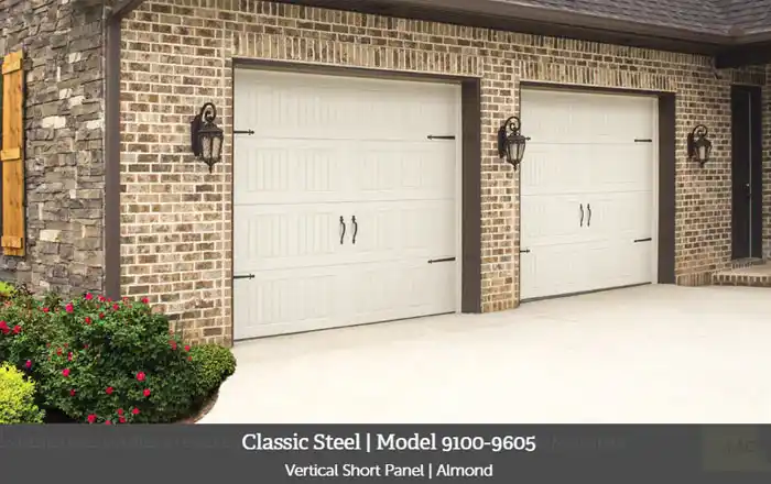 Wayne Dalton Model 9100-9605 garage doors with vertical short panels in almond finish, featuring decorative hardware, installed on a brick home.