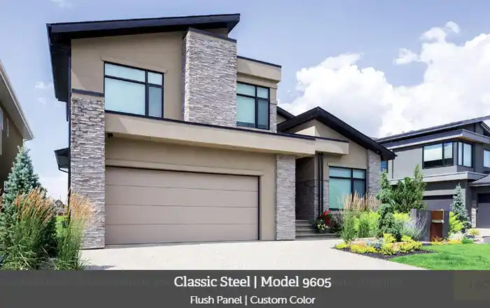 Wayne Dalton Model 9605 garage door with a flush panel design in a custom color, installed on a modern home with stone and stucco exterior.
